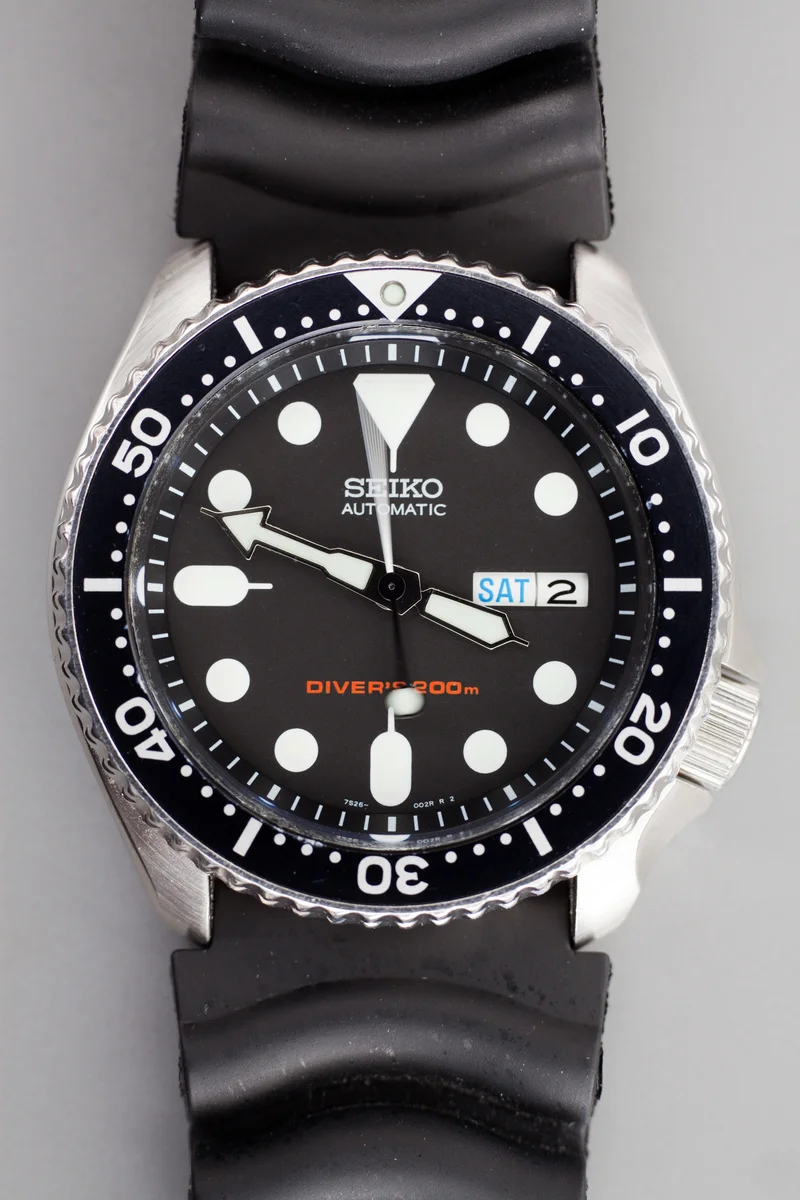 Seiko SKX007 with a black dial, timing bezel and rubber strap